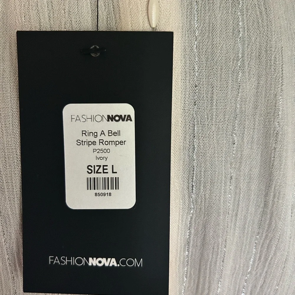 Fashion Nova cream with silver stripes short set zip up back. Plunging neckline.